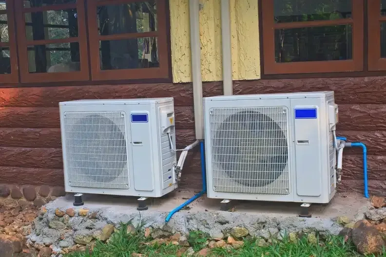 Ductless AC units installed outside a rustic home for energy-efficient cooling in Bergen County

