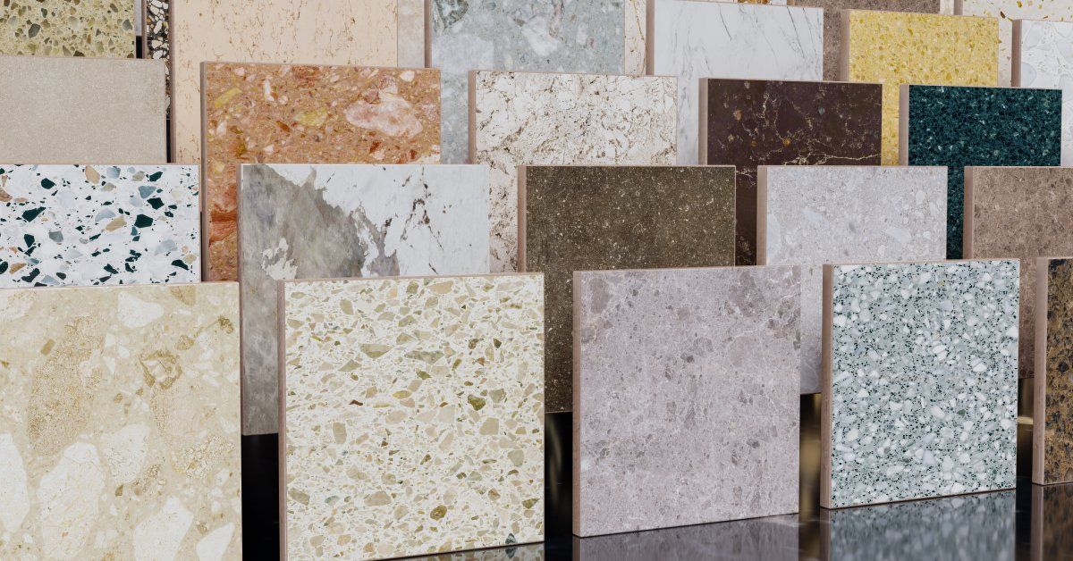Five rows of small stone tiles, each row higher than the next. Each tile is a different color and pattern.