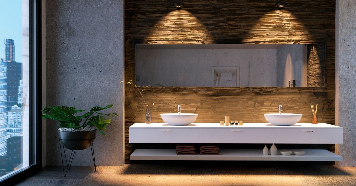 A large white double vanity in a bathroom. The vanity is next to a massive window overlooking a city.