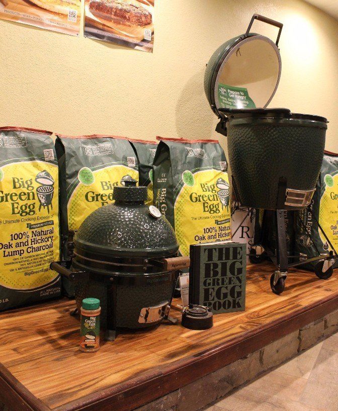 A table with a bunch of bags of big green eggs on it