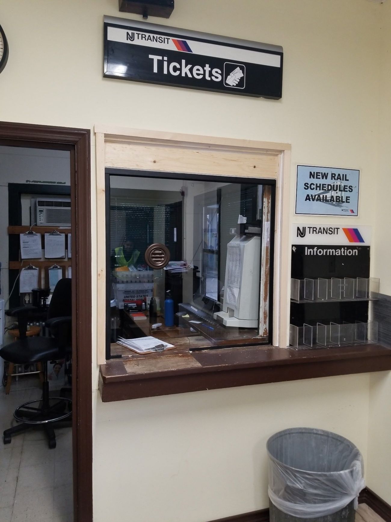 A window with a sign above it that says tickets