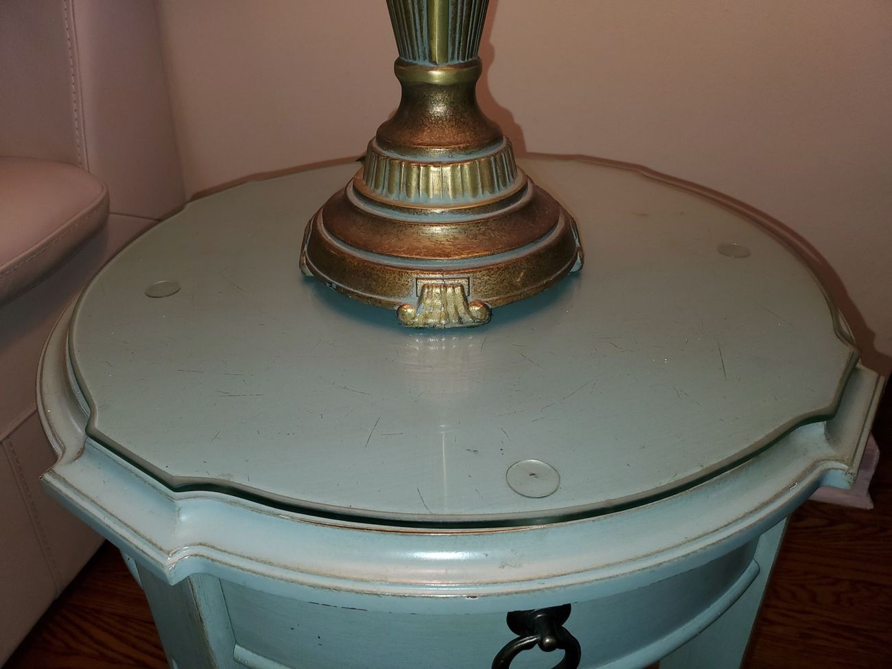 A lamp is sitting on top of a light blue table