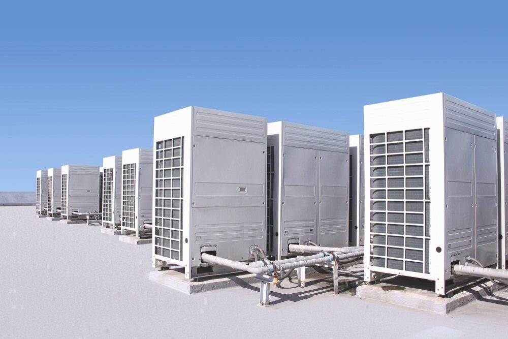 A Row Of Air Conditioners Sitting On Top Of A Building — Bear Air Conditioning In Gosford, NSW