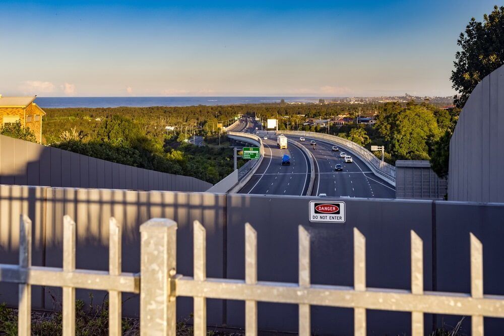 A Highway With A Fence In The Foreground — Bear Air Conditioning In Hamlyn Terrace, NSW
