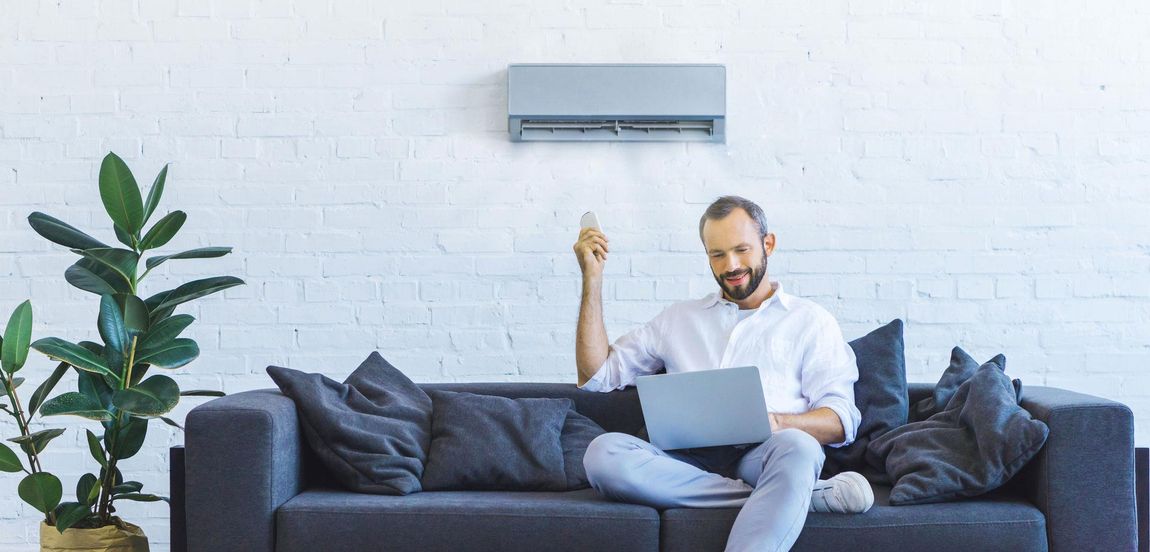 Man Opening Air Condition — Bear Air Conditioning In Bateau Bay, NSW