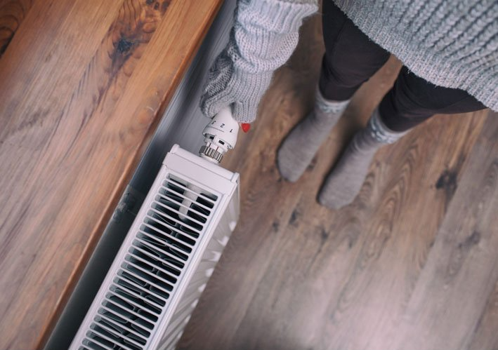 Heating specialist checking on pipes — Bear Air Conditioning In Bateau Bay, NSW