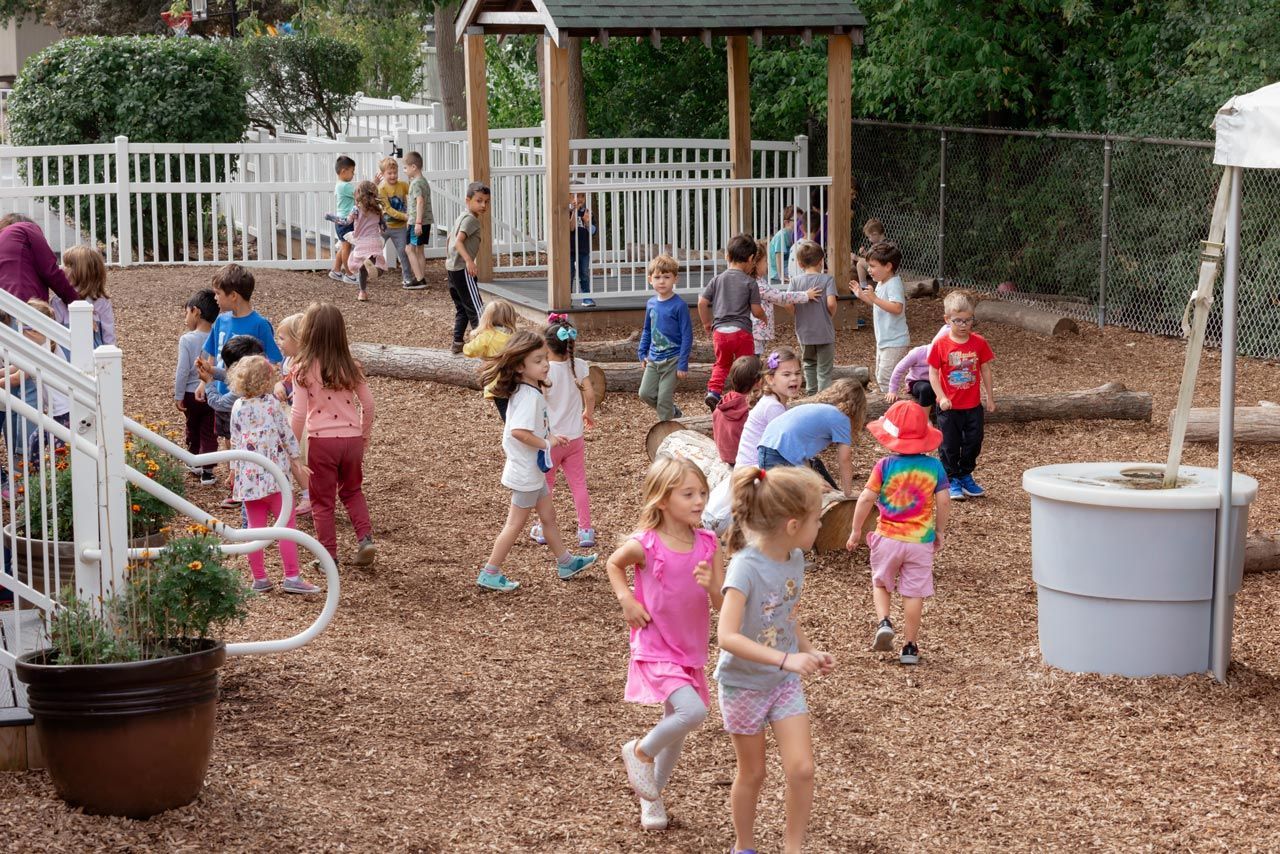 group of Montessori students playing together during outdoor recess