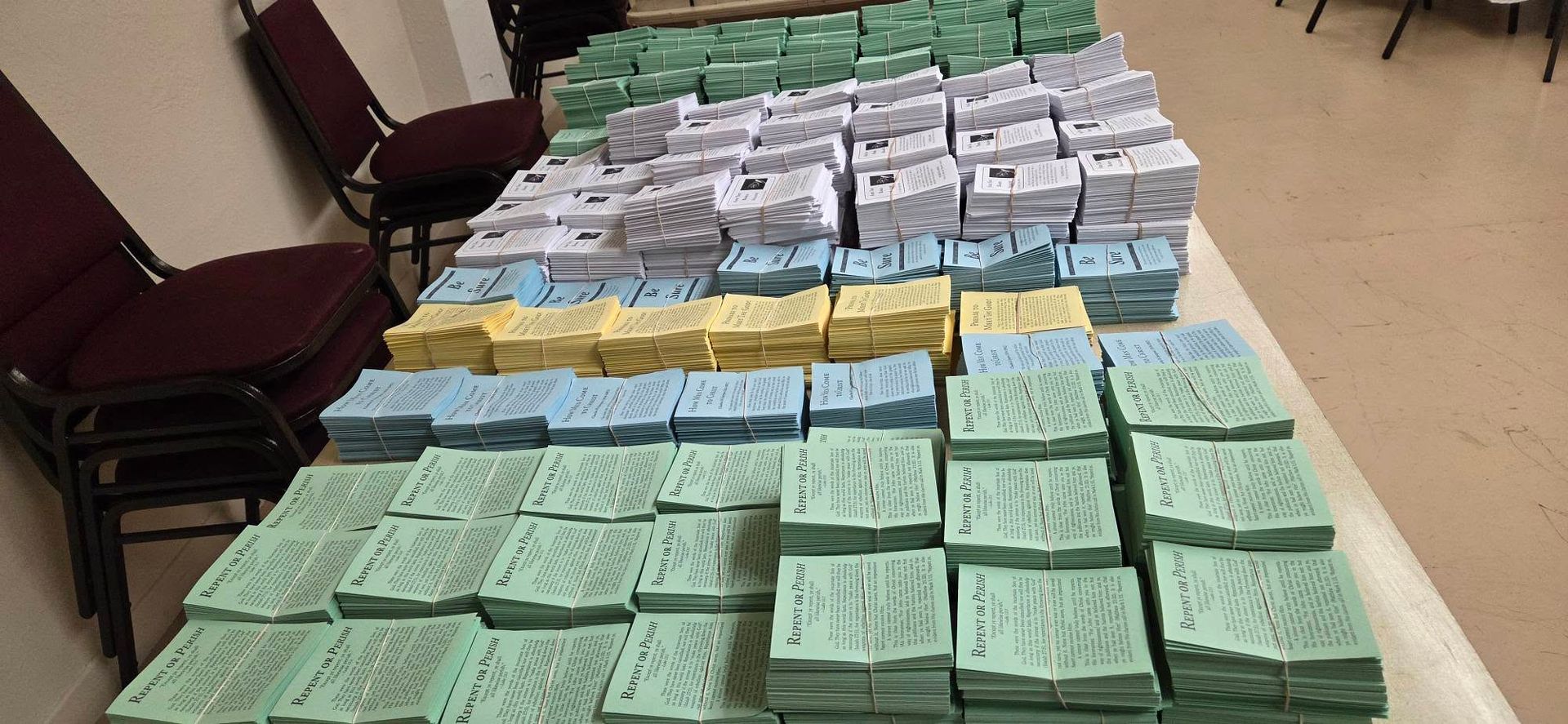 Thousands of Gospel tracts prepared for a single outreach — this is what monthly giving actually funds.