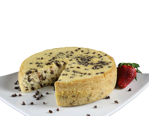 A cake with chocolate chips and a strawberry on a white plate