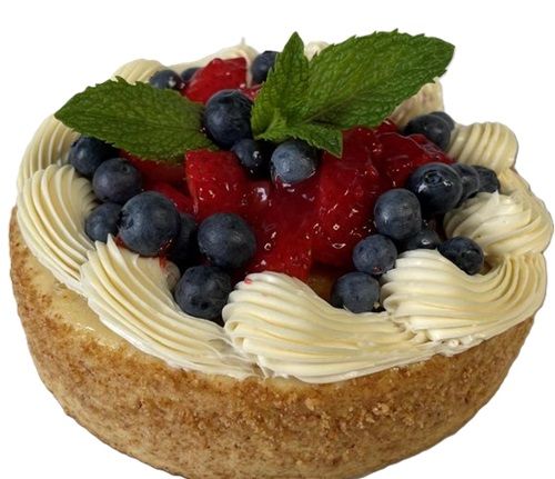 A cheesecake with strawberries and blueberries on top