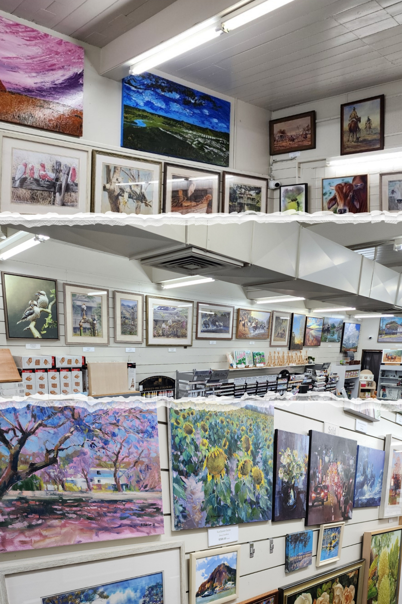 A room filled with lots of paintings on the walls and shelves.