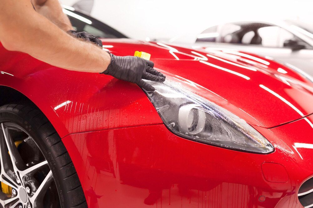 Person Wearing Black Gloves — Gladstone Mufflers & Suspension In Gladstone Central, QLD