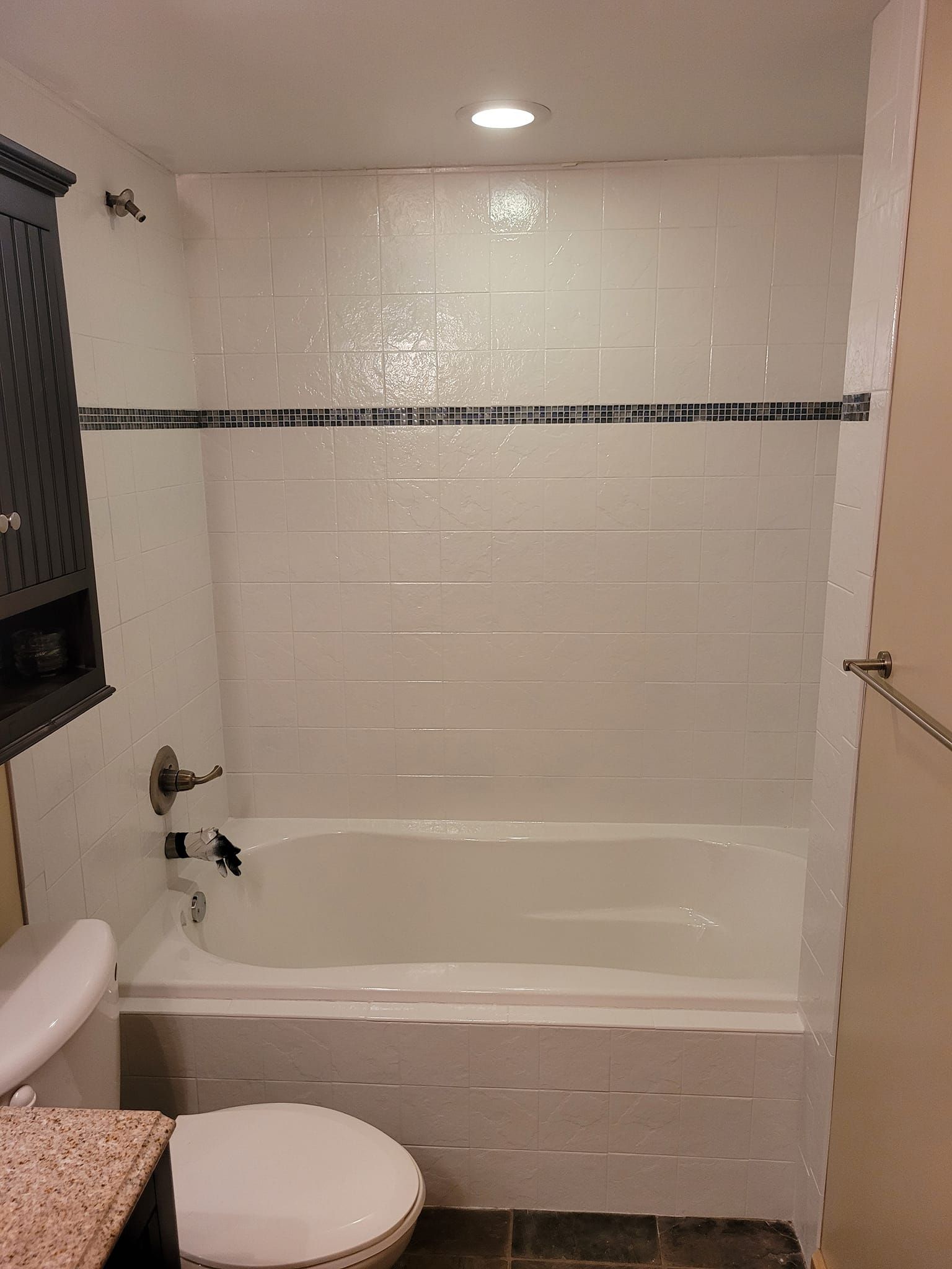 Image of a bathroom that is getting a bathtub reglazing job done. 