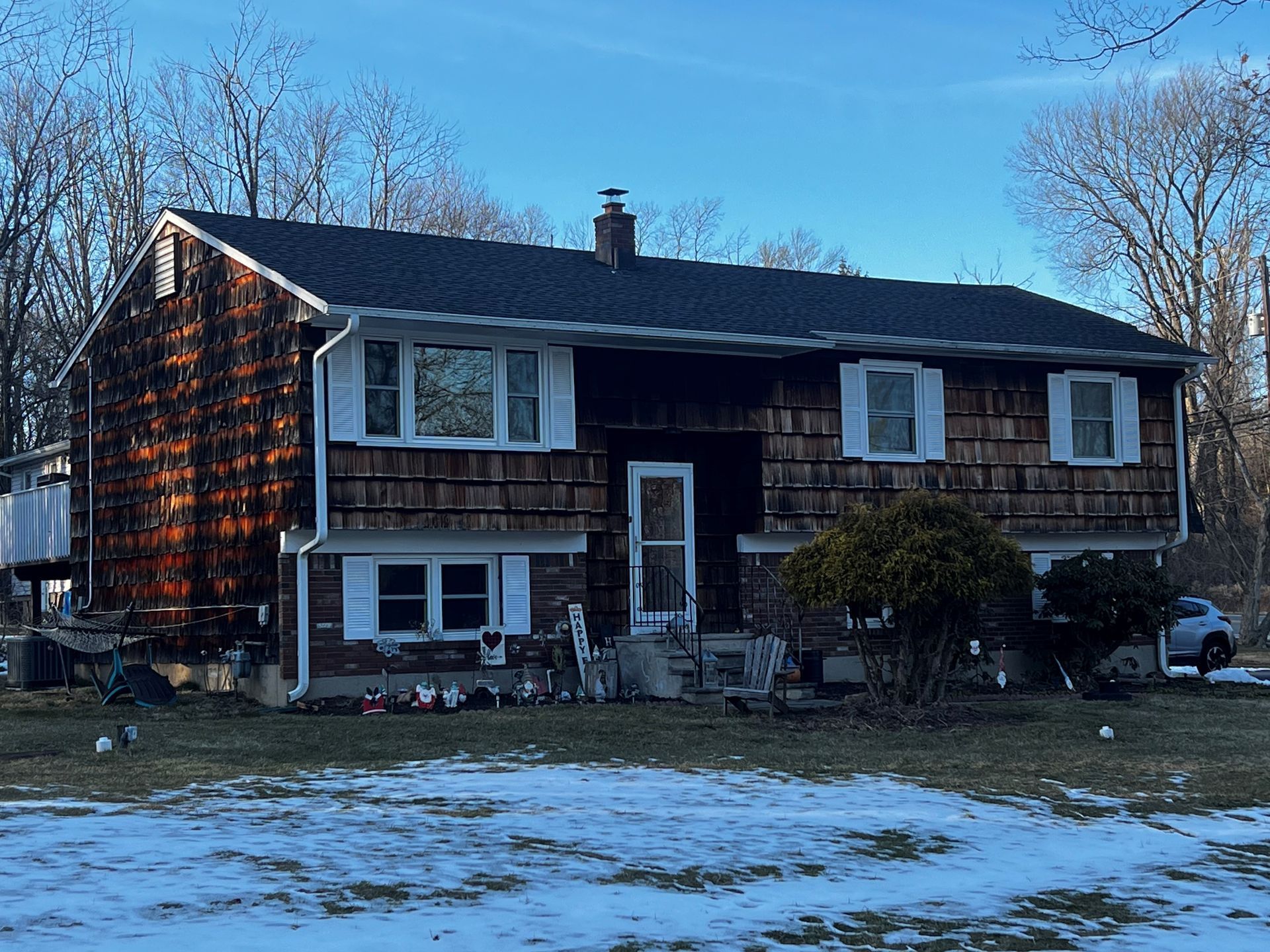 Large House With Black Roof — Roxbury, NJ — Four J’s Contracting & Roofing LLC Large House With Black Roof — Roxbury, NJ — Four J’s Contracting & Roofing LLC