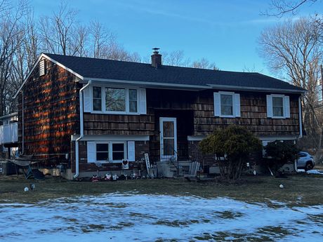 Large House With Black Roof — Mendham, NJ — Four J’s Contracting & Roofing LLC Large House With Black Roof — Mendham, NJ — Four J’s Contracting & Roofing LLC