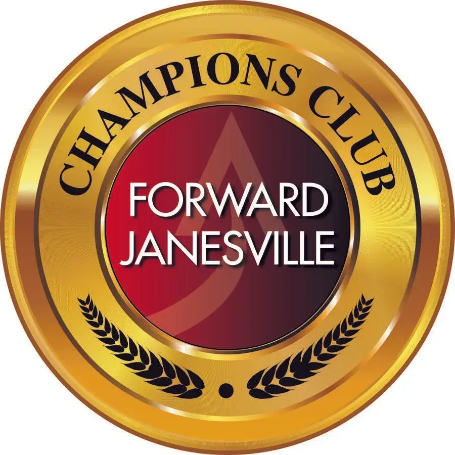 Gold Champions Club emblem with red center reading “Forward Janesville”