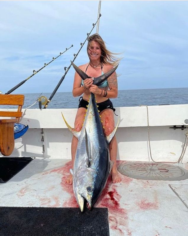 big shark caught by boy and man