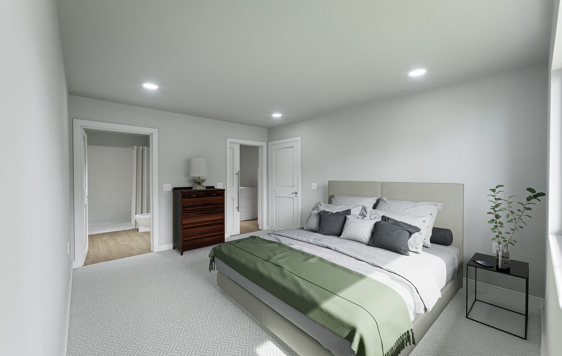 a bedroom with a large bed , dresser and nightstand .