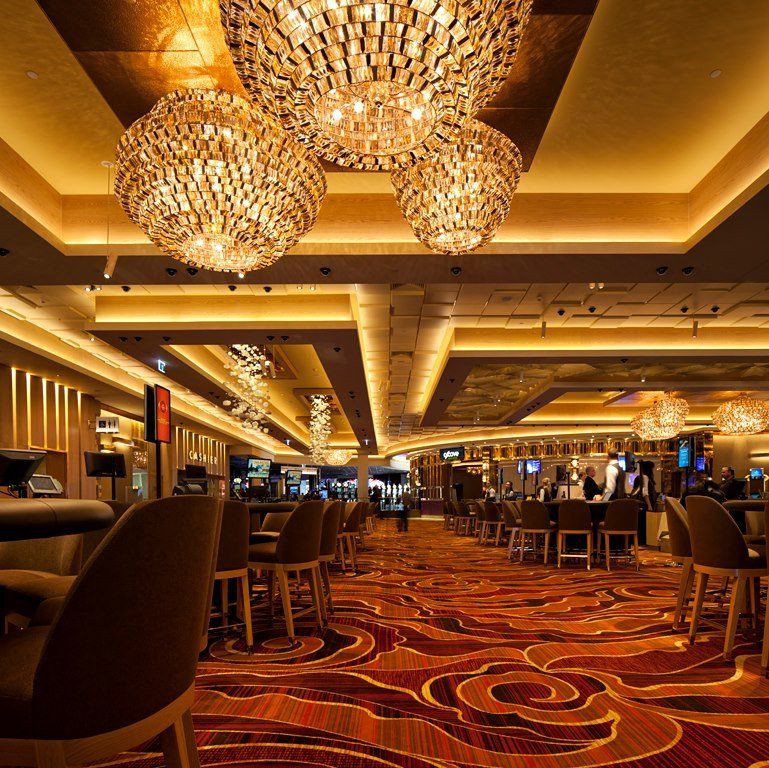 A large room with lots of lights and chairs