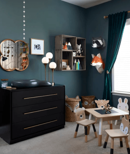 A child 's room with a table and chairs and a dresser