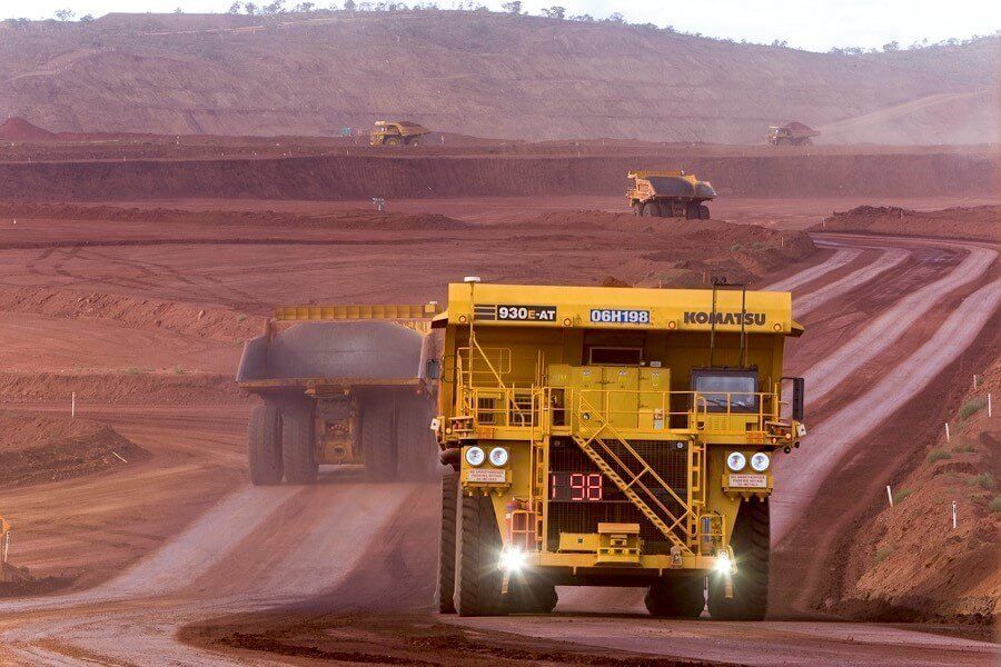 Trucks hauling raw materials at mine operation