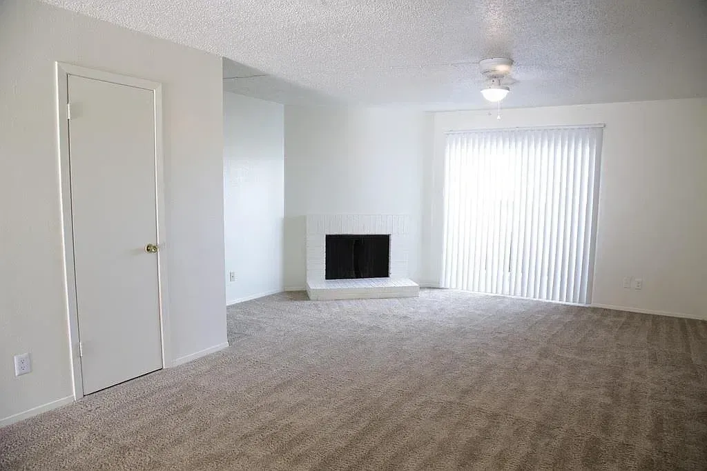 Living room with fireplace and sliding glass door