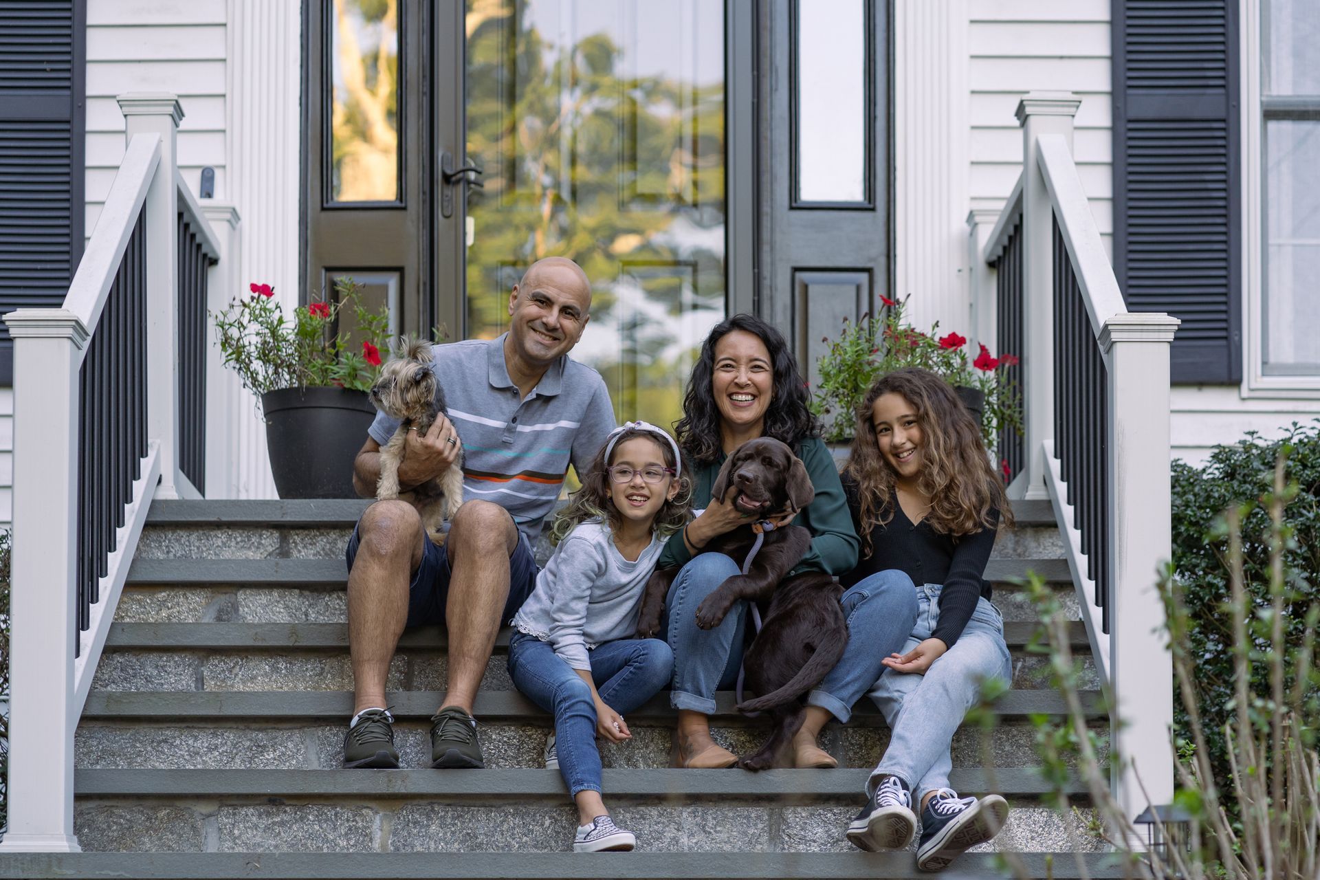 Family in front of their home – Dayton, OH - C & G Mortgage