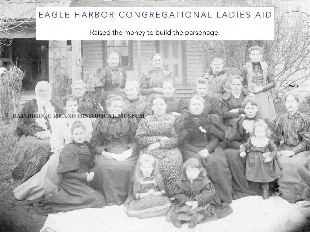 A black and white photo of a group of women and children