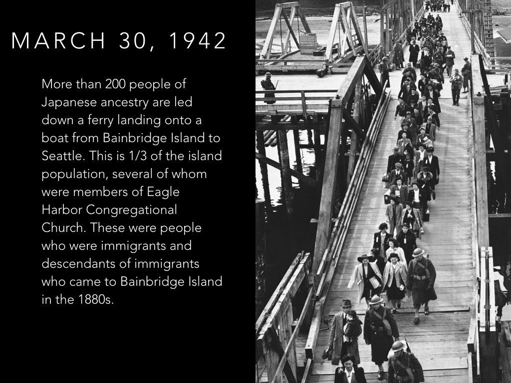 A black and white photo of people walking across a bridge