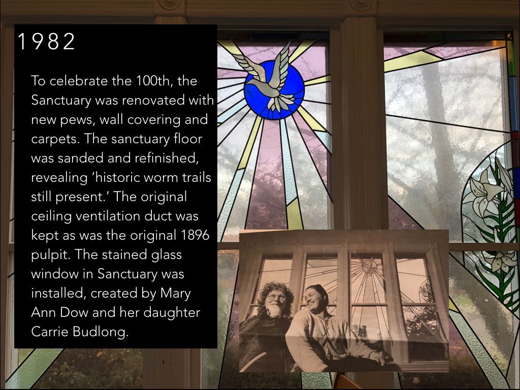 A stained glass window with the year 1982 on it