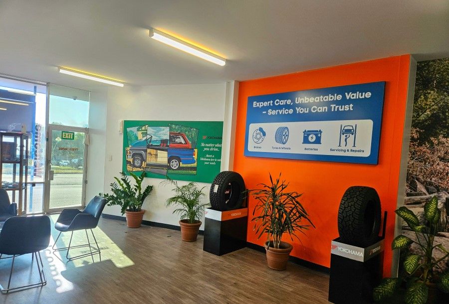 A Waiting Room With a Sign on the Wall — City Tyre Service in Darwin City, NT