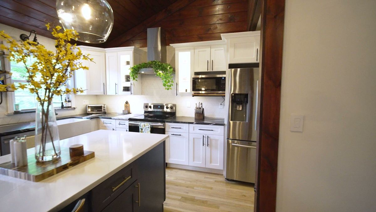 Kitchen island, stainless appliances and wood ceiling at 12 Pond Road