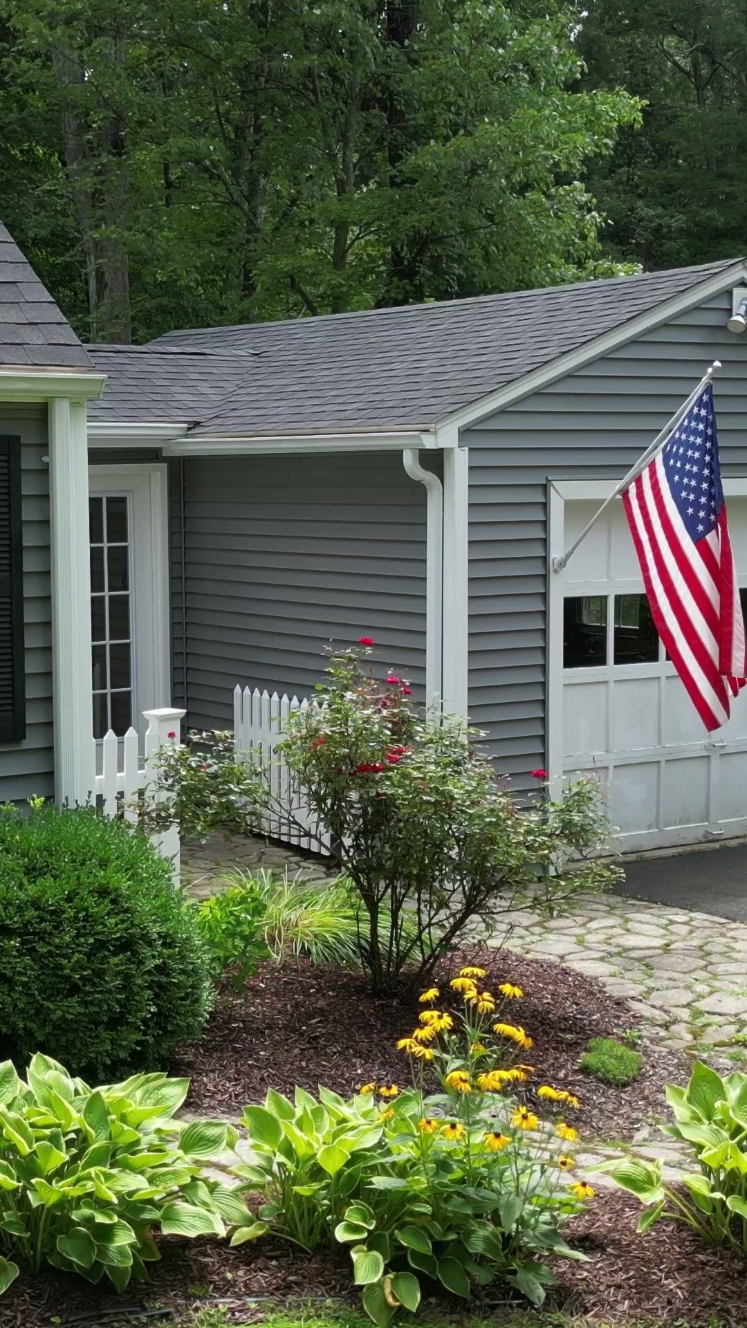House exterior and planting beds at 186 West Mountain Road