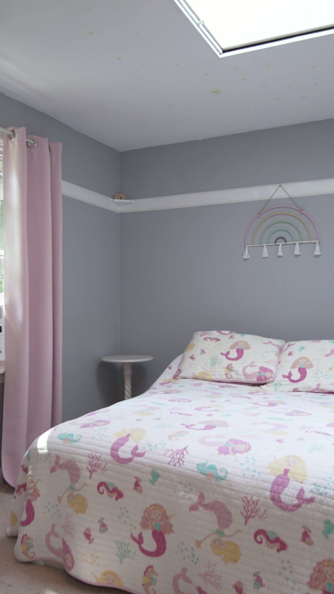 A bedroom with a skylight in the vertical property film