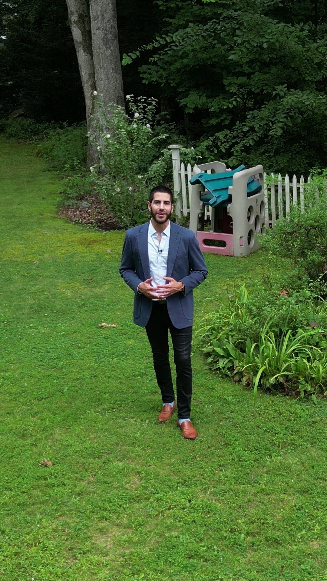 Lou Raven presents from the lawn behind the house
