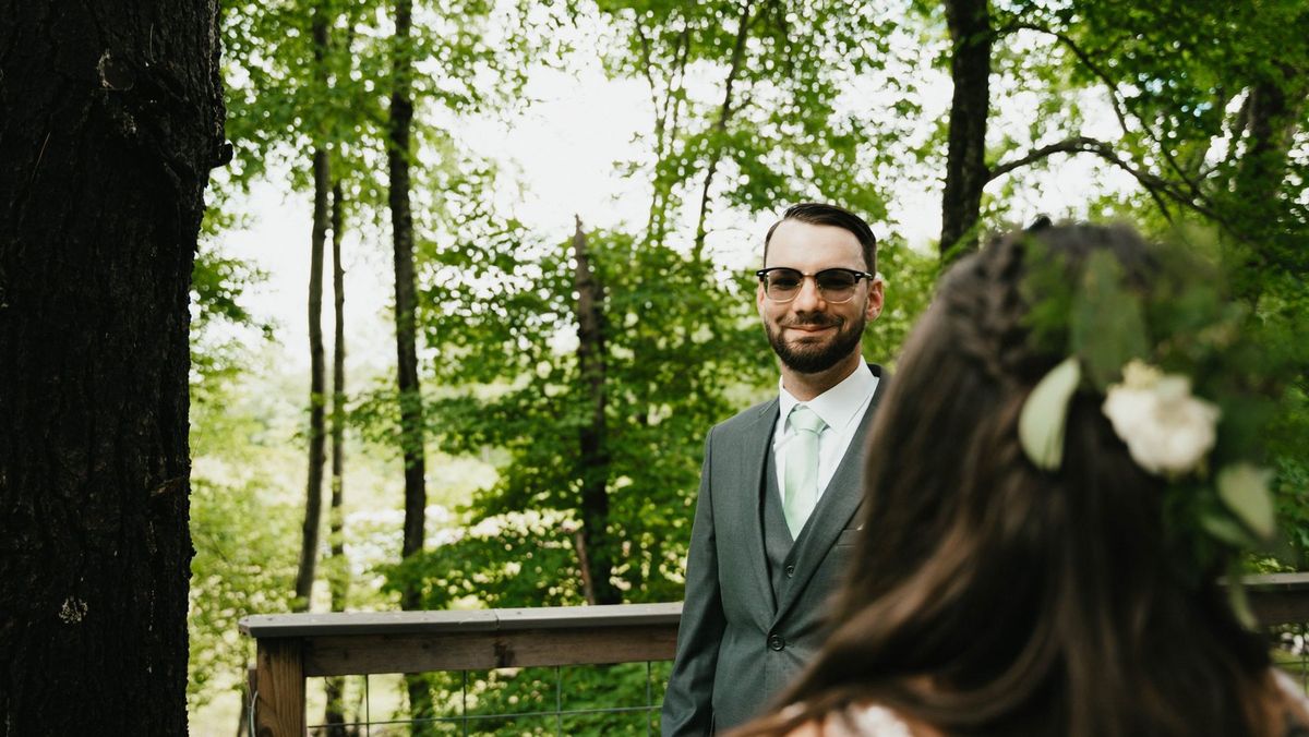 Anthony turns toward Ashley during their first look on the deck