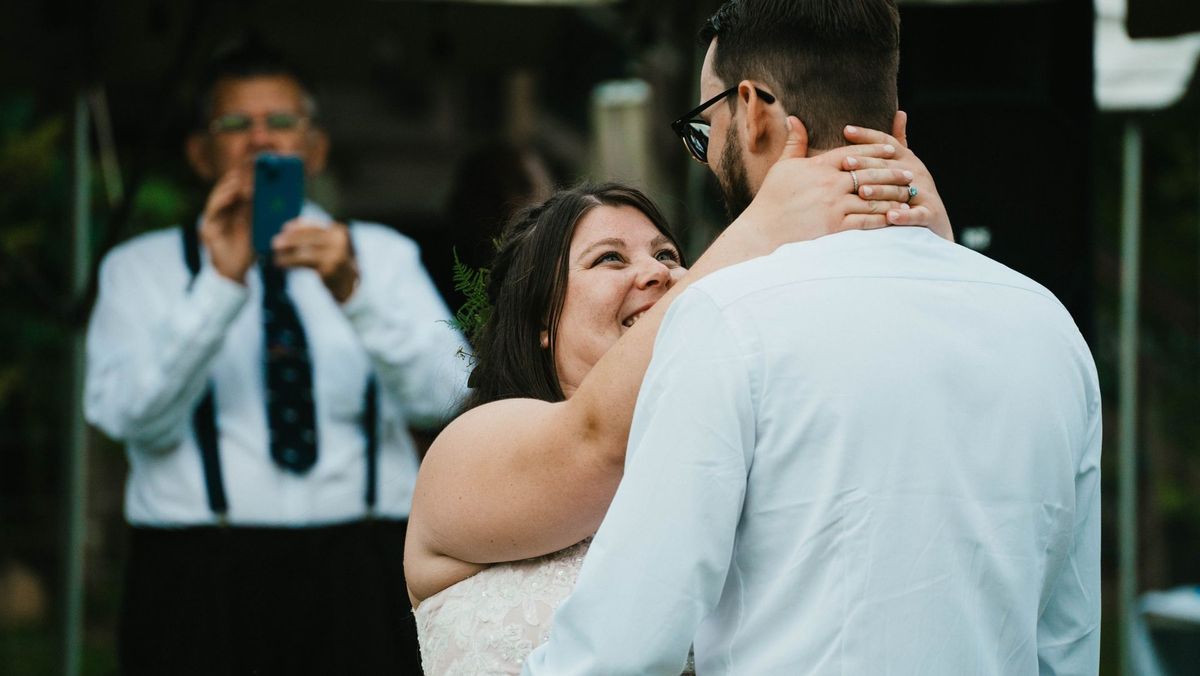 Ashley smiles up at Anthony in a close view of their dance