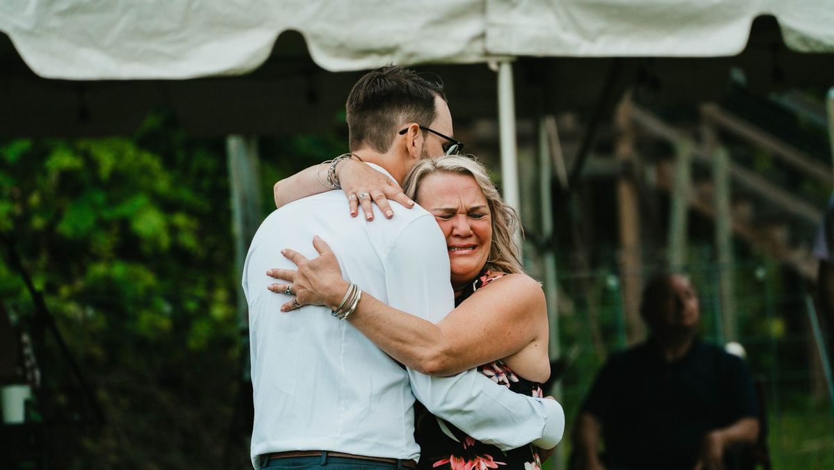 Anthony embraces a loved one during a dance