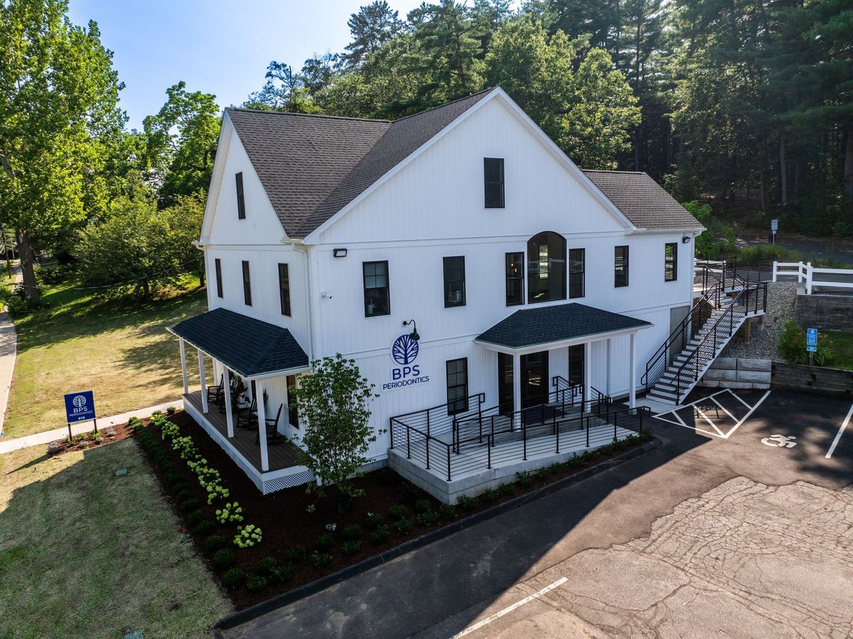 Aerial view of the white BPS Periodontics practice building