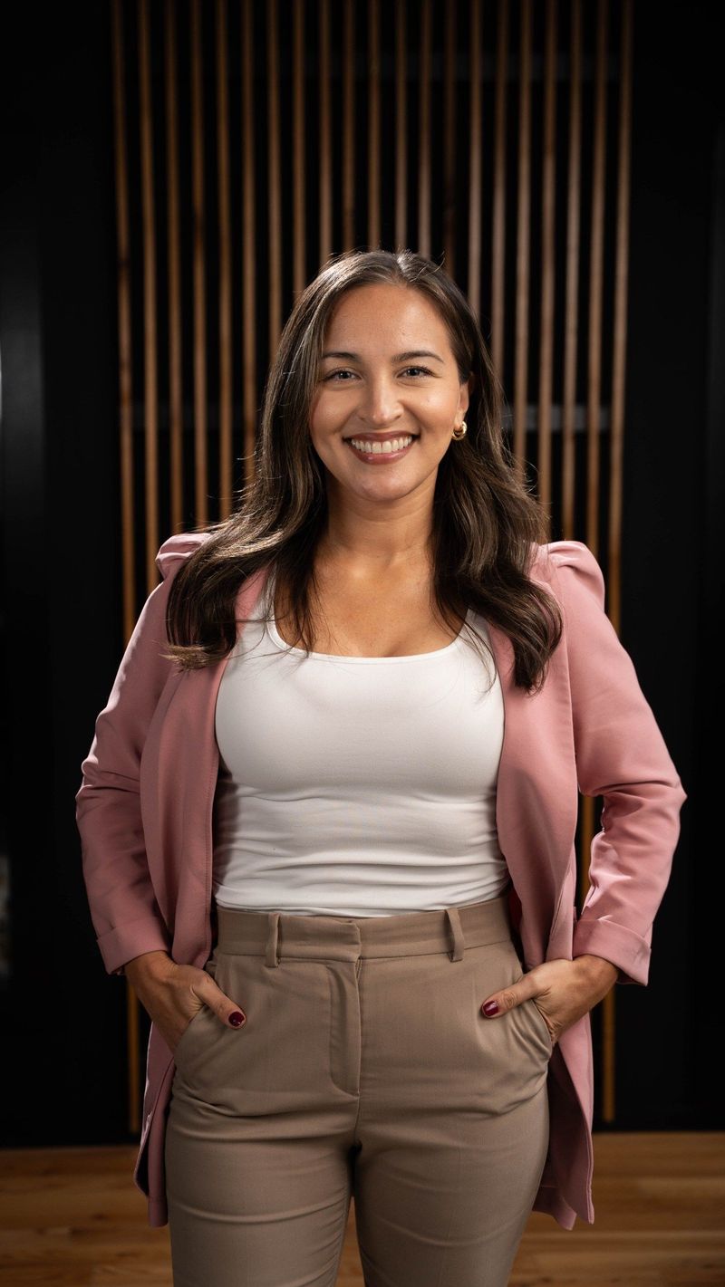 Brooke Team member in a pink jacket with hands in pockets