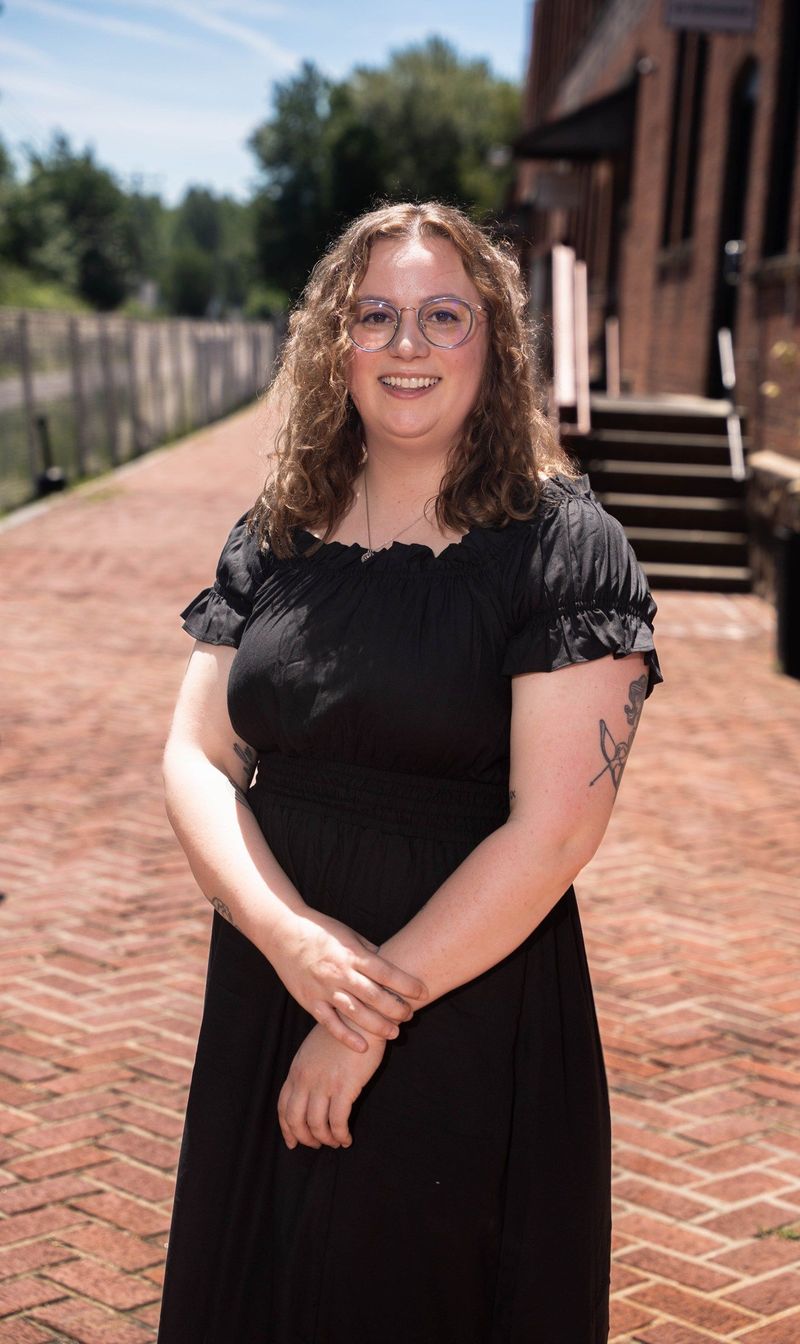 Outdoor three-quarter portrait of the Brooke Team recruit on a brick walkway
