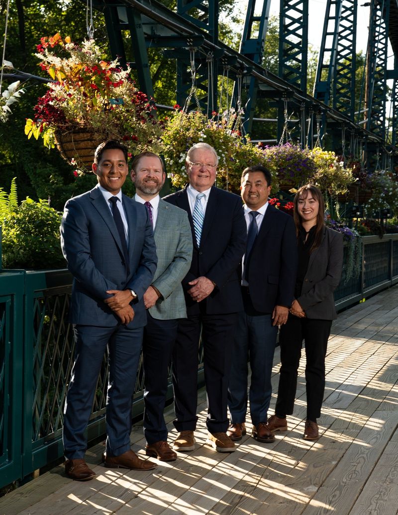 Closer outdoor portrait of the Center of Dental Excellence team standing close together
