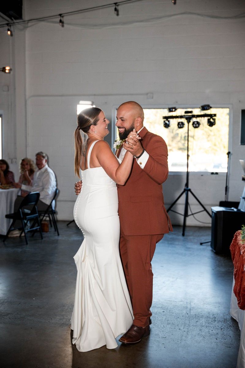 Jacob and Thea dance together inside Warehouse 635