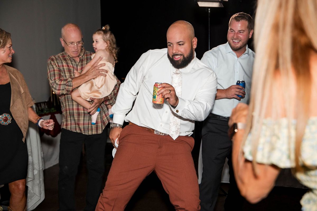 Jacob dances among guests at the reception