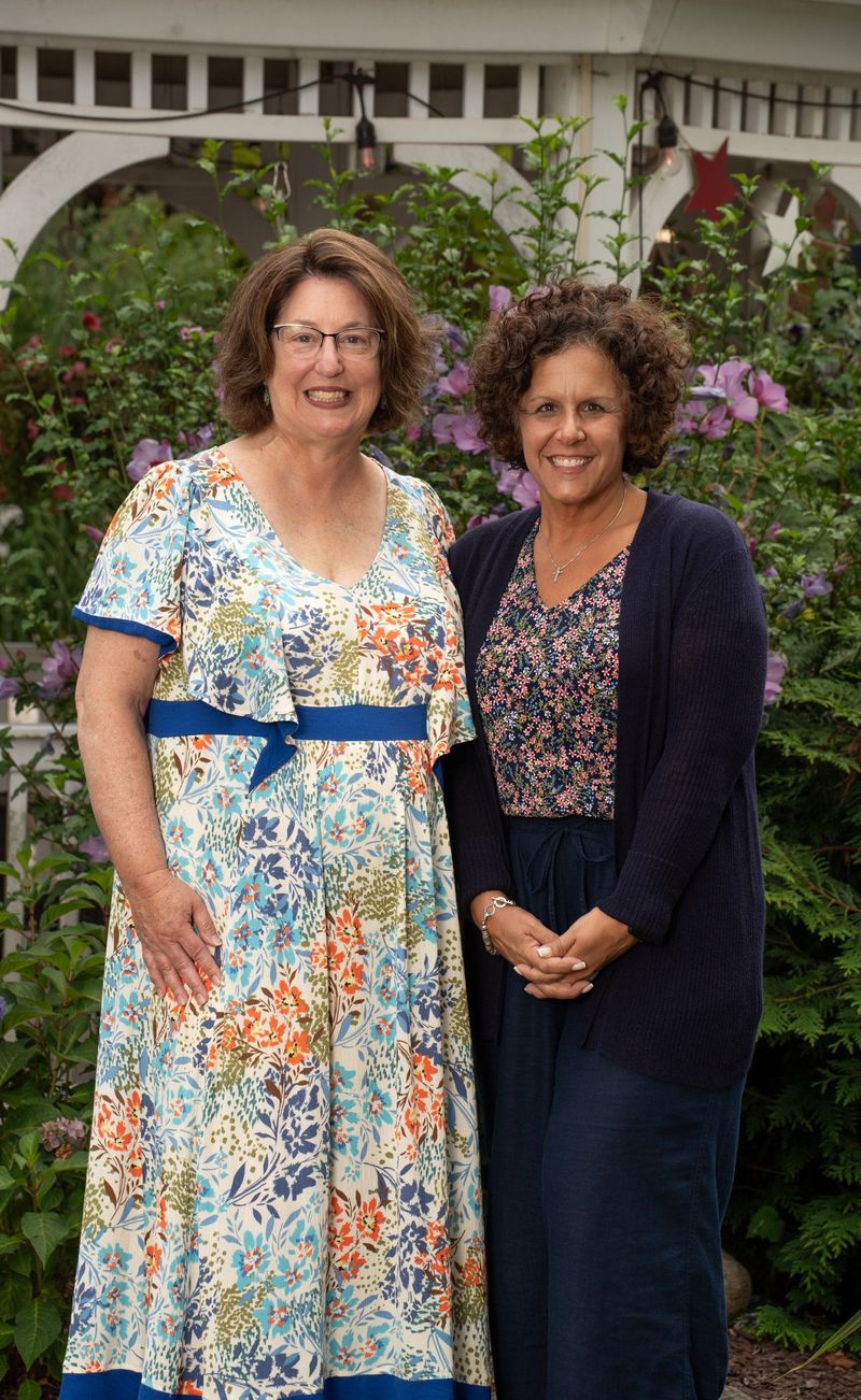 Two people posed together outdoors in a portrait at Jerome Home