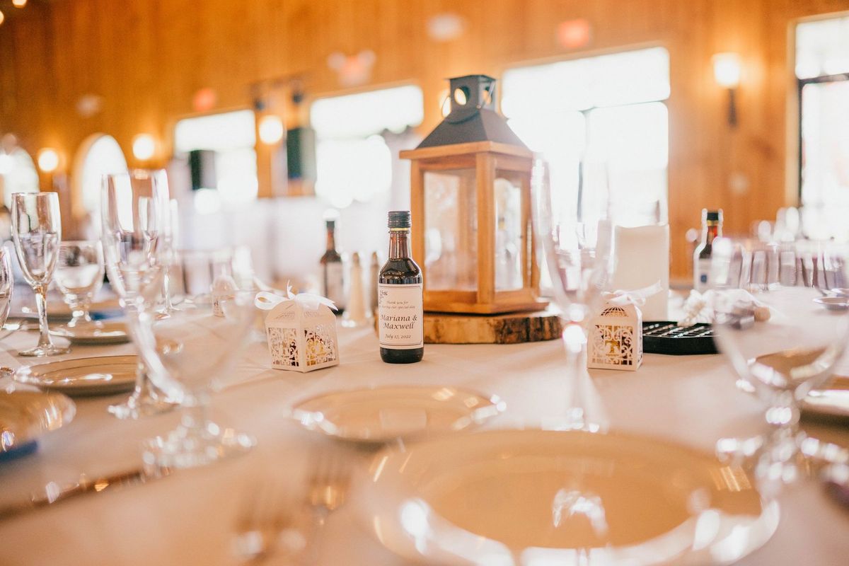 Lantern and glassware on a wedding reception table