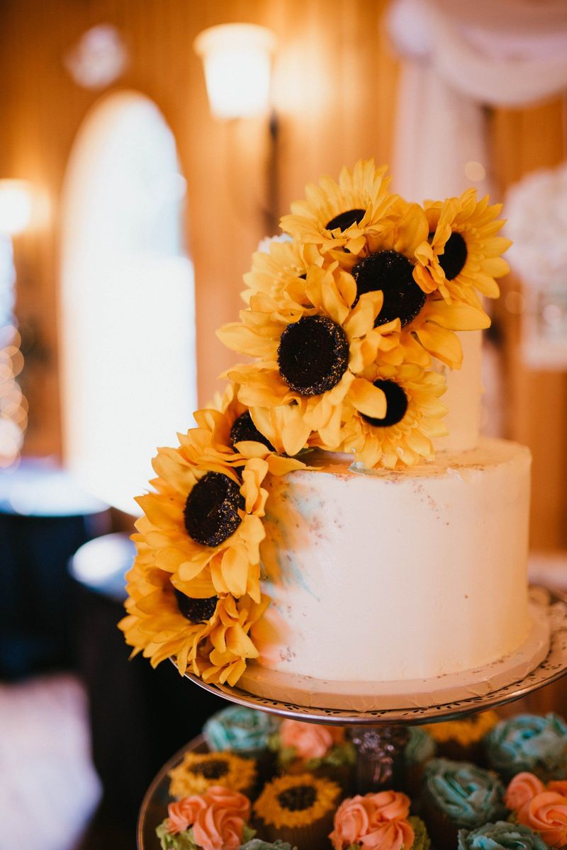 Wedding cake decorated with sunflowers
