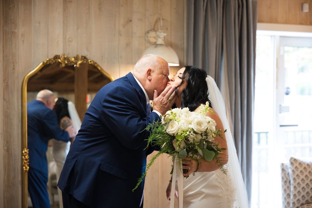 Sadie shares an affectionate moment with a family member before the ceremony