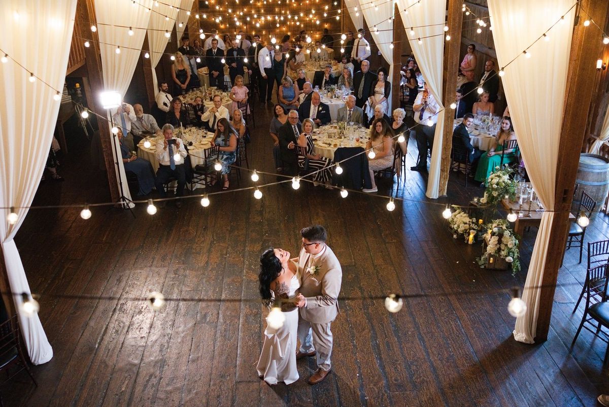 An elevated view of Sadie and Mat’s first dance surrounded by their guests