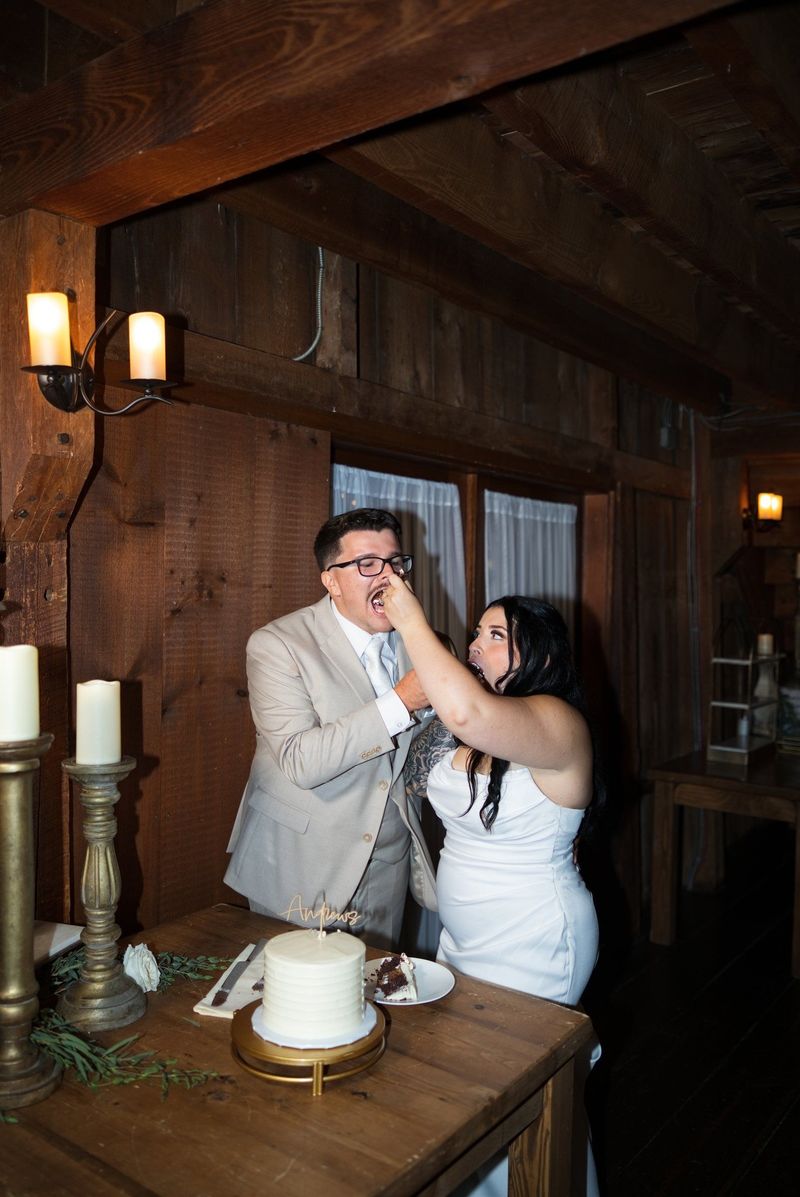 Sadie feeds Mat a bite of wedding cake